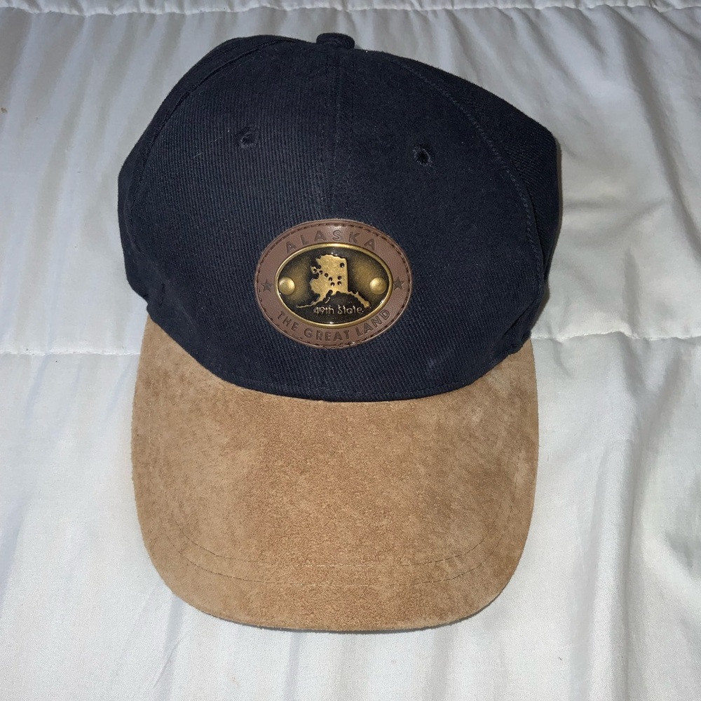 Alaska, blue and tan cap.